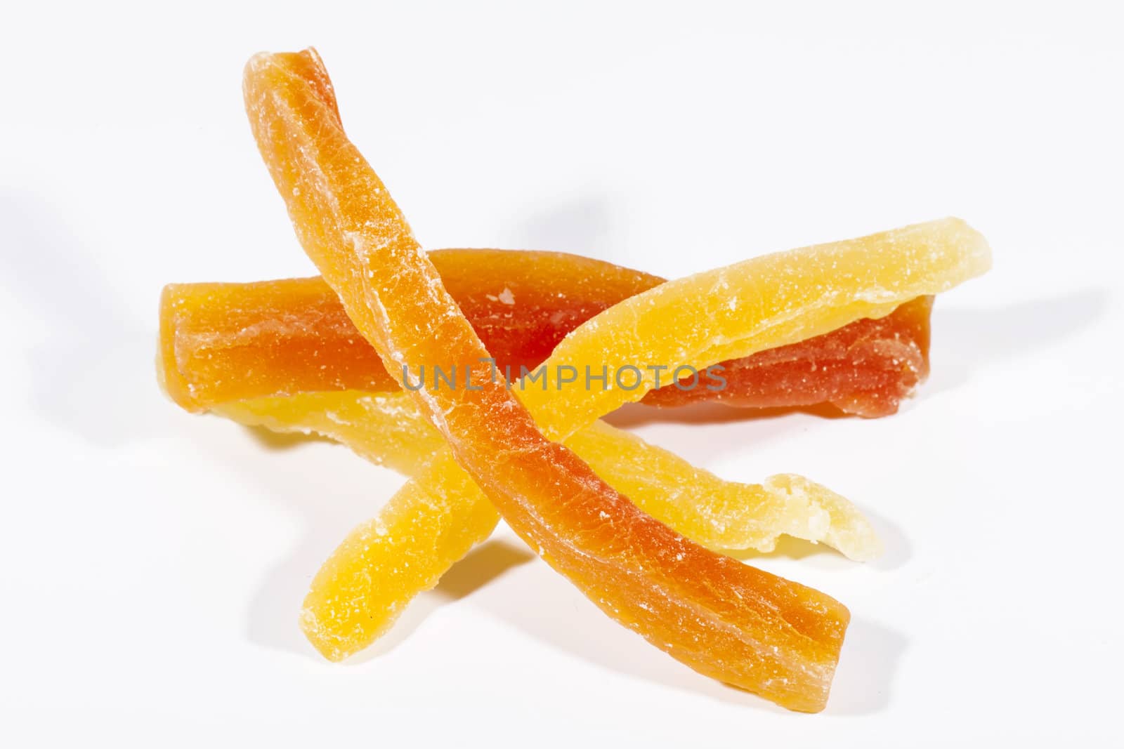 Sweet papaya fruits in sugar isolated on white