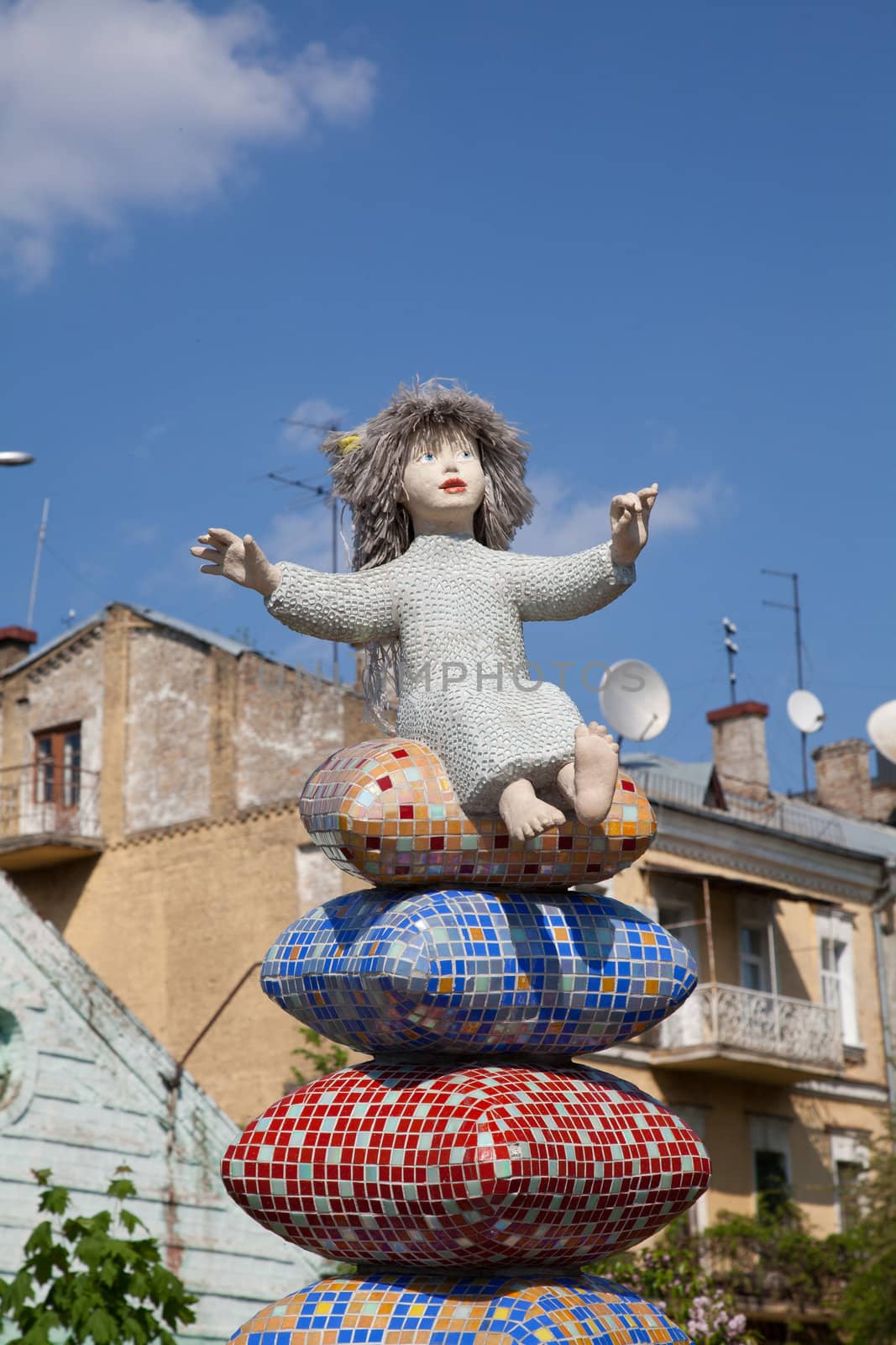 Child on pillow statue by RawGroup