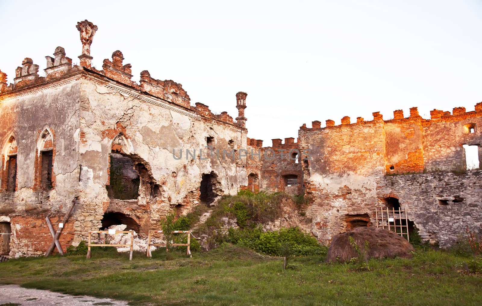 Medziboz castle ancient ruins during the sunset
