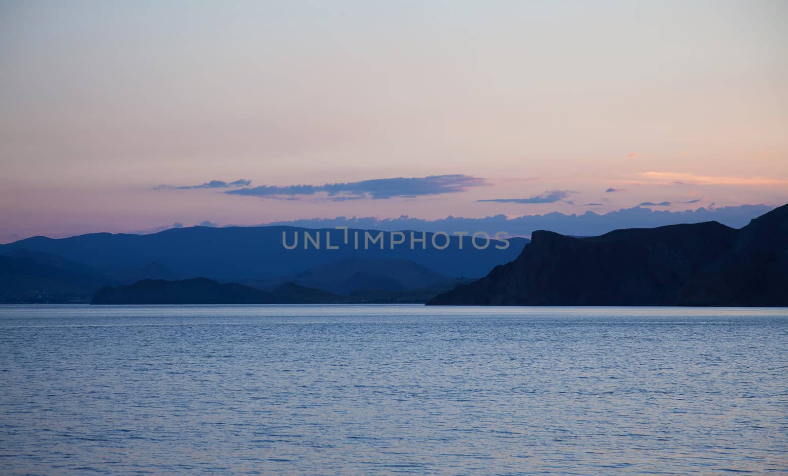 Purple sunset on black sea in Crimea