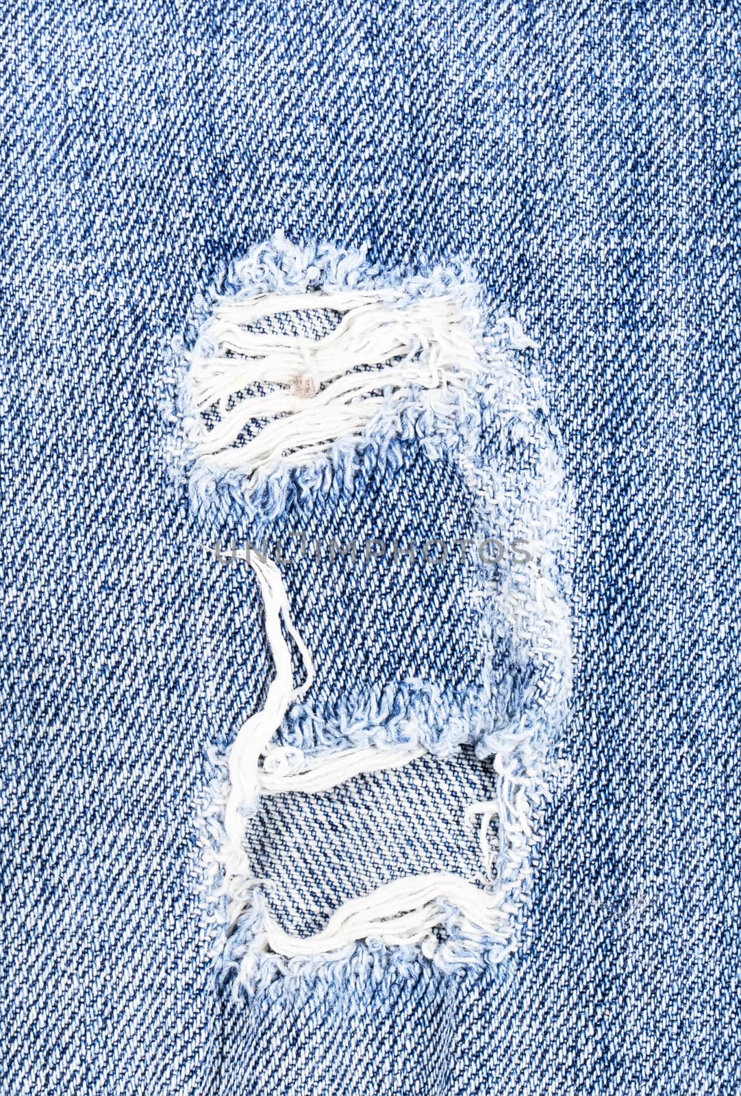Beautiful hole in jeans textile