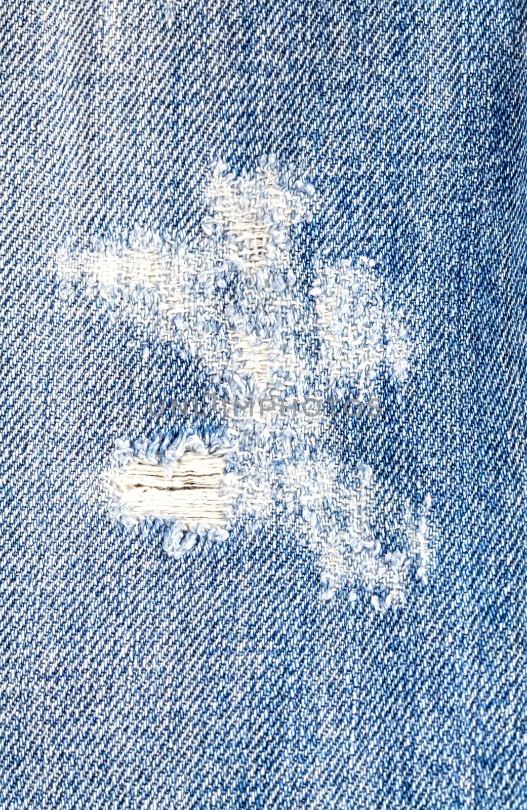 Hole on jeans denim fabric texture
