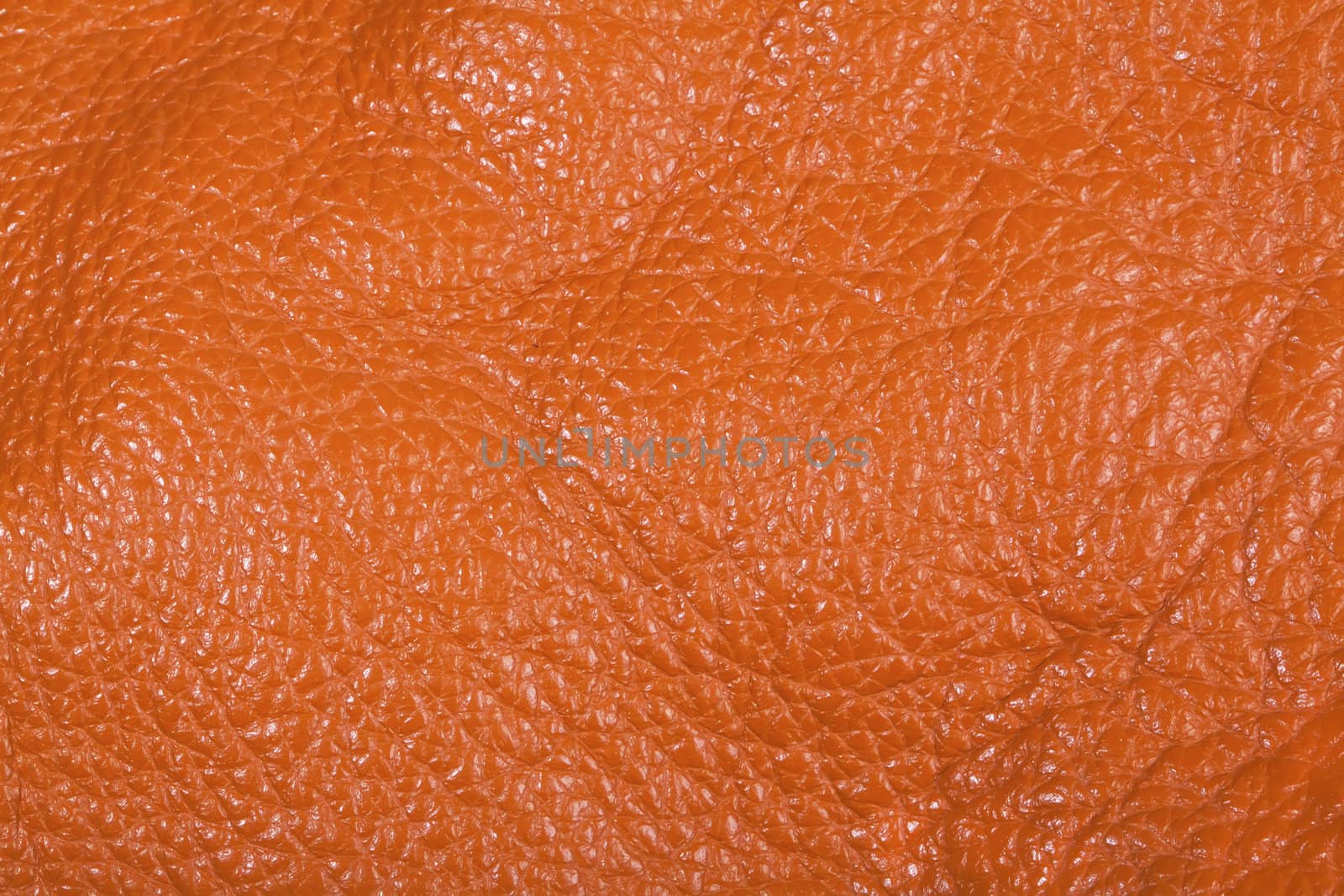 Orange leather texture background close view