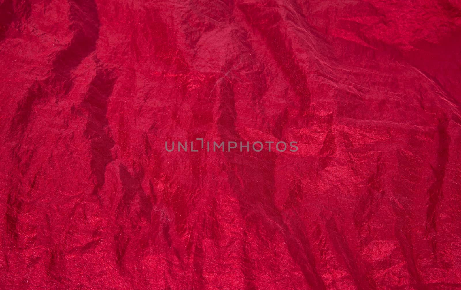 Shiny red fabric taffeta background by RawGroup