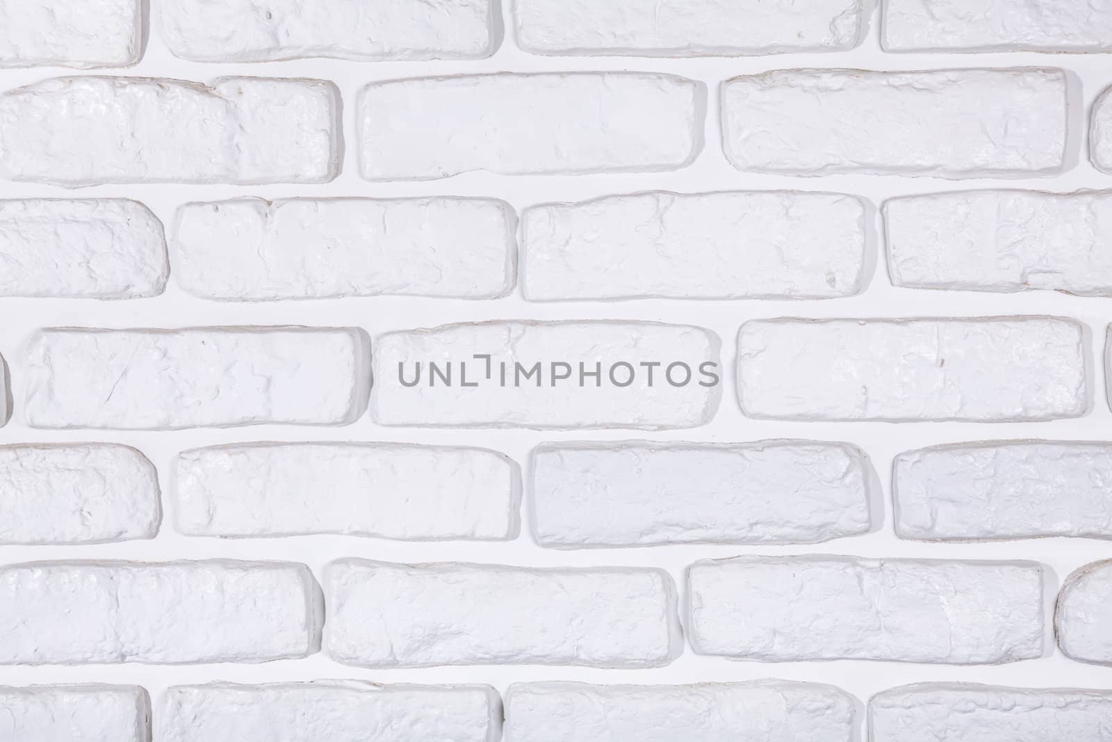 White painted brick wall texture background by RawGroup