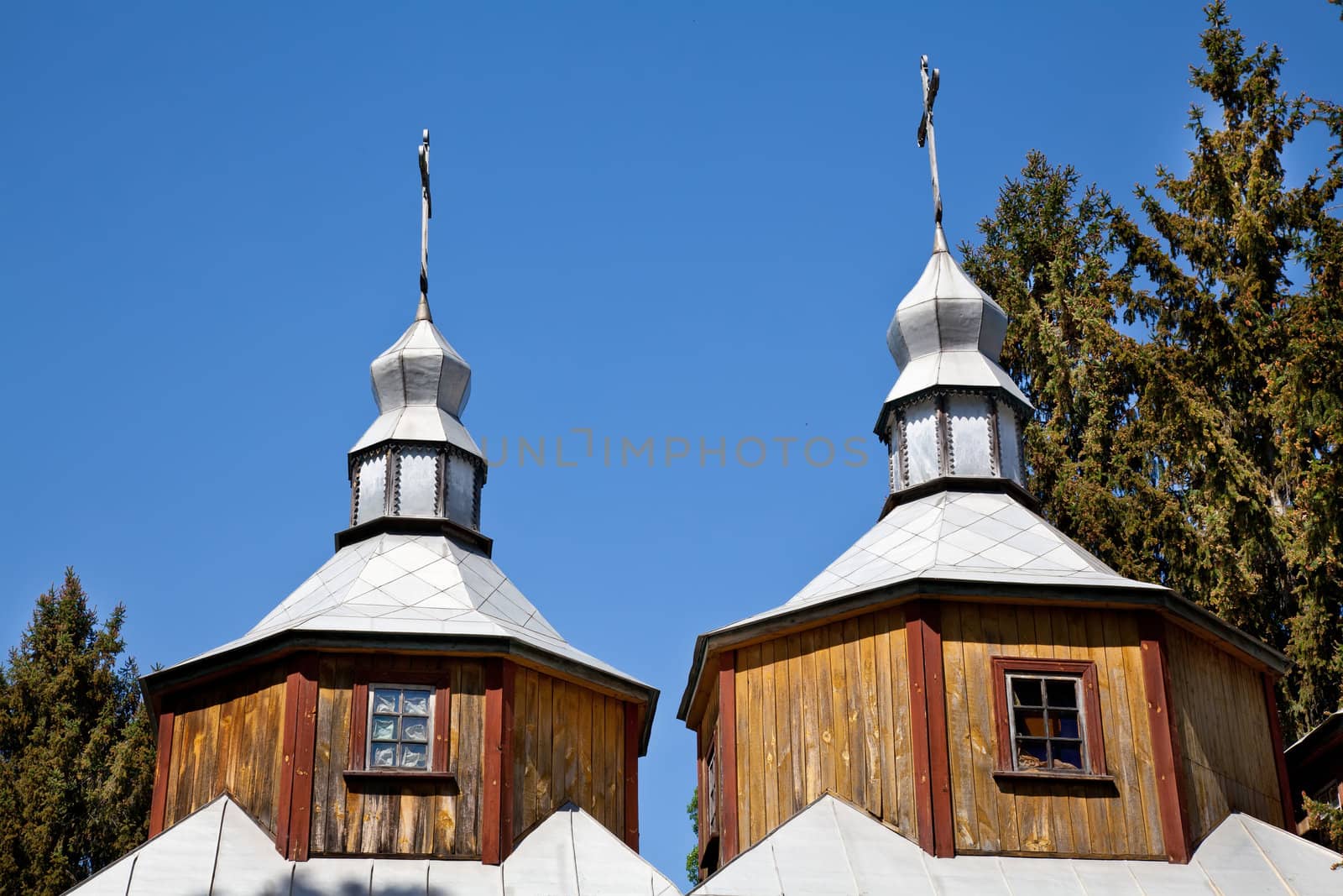 Two domes with crosses of wooden church