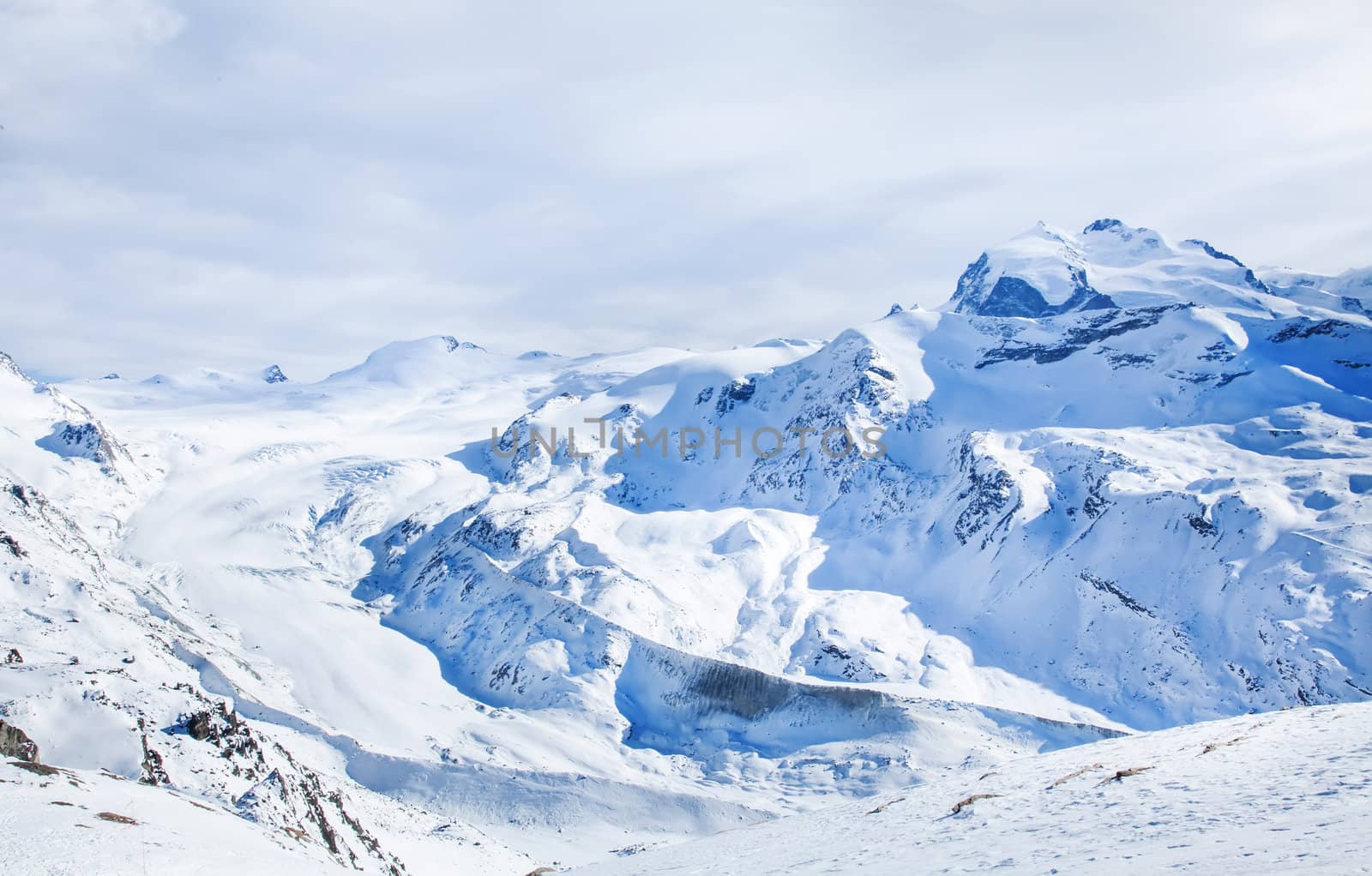 Winter blue and white landscape on Switzerland hills in February