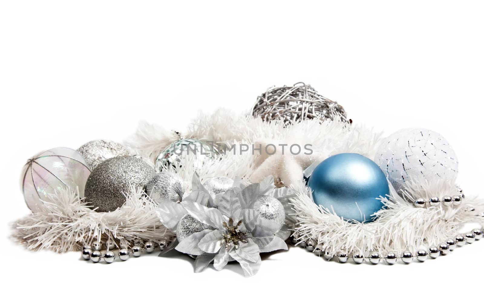 Christmas composition with blue ball and silver flower on white background