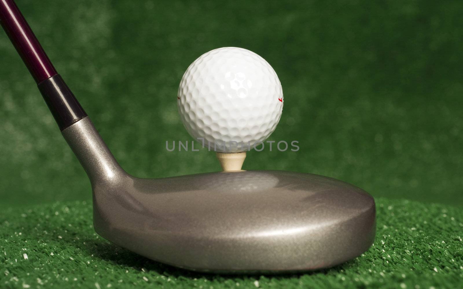 A golf club prepares to drive the ball