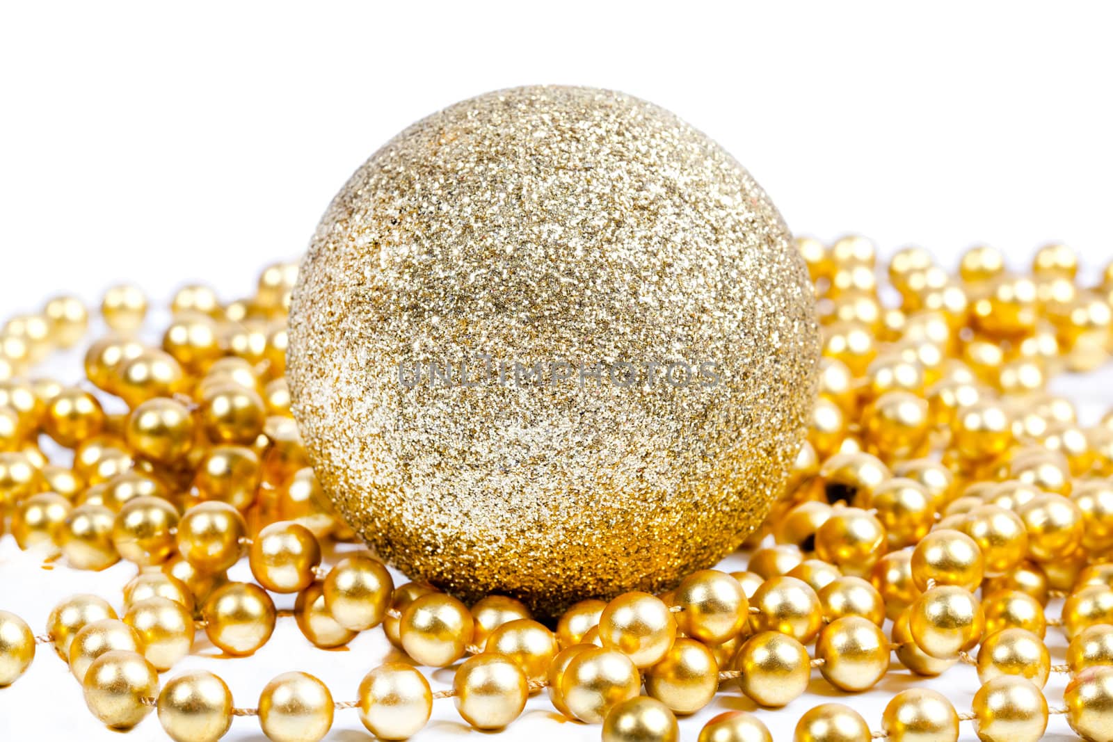 Golden Christmas decoration ball among golden beads by RawGroup