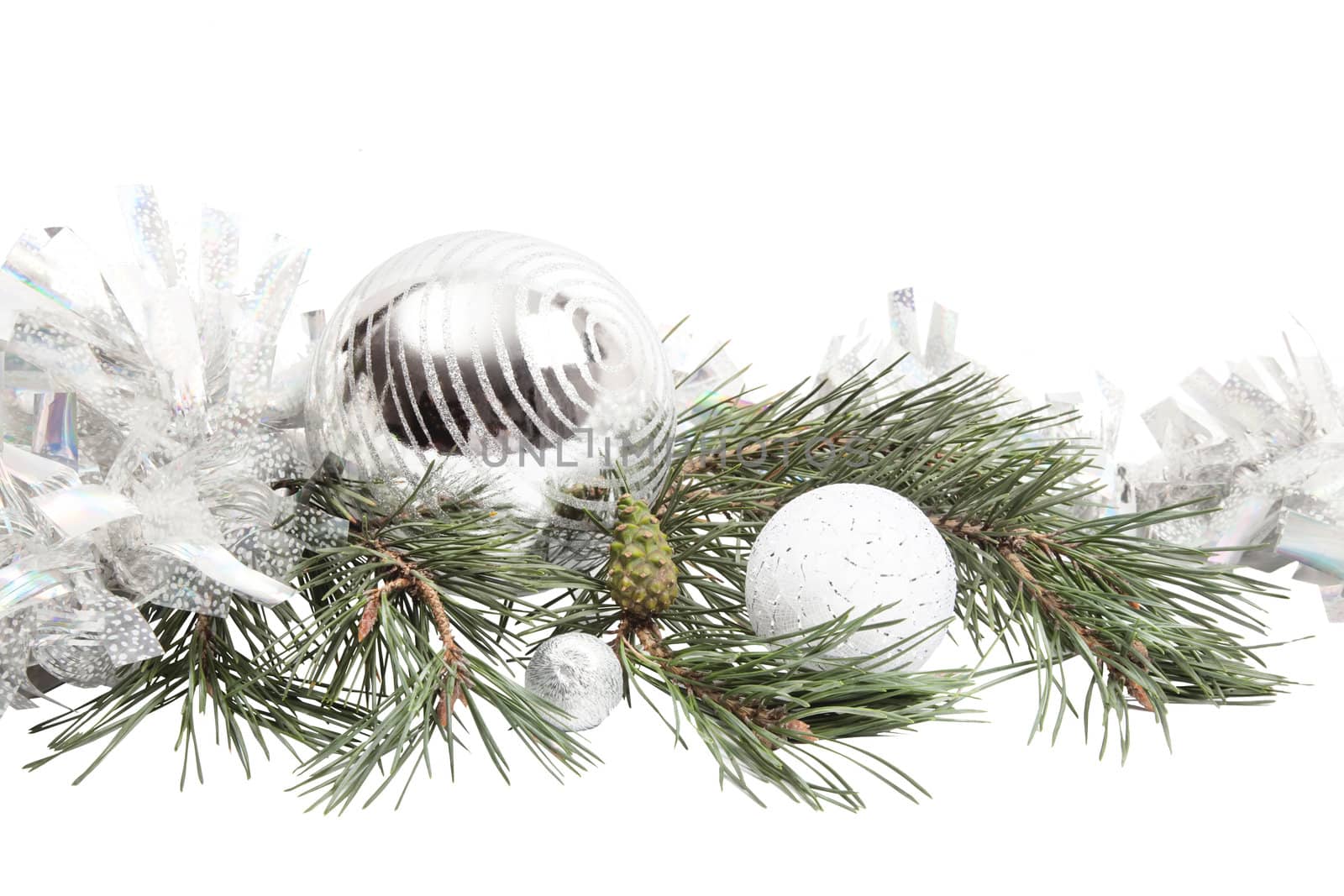 New Year composition with fir branch, silver ball and tinsel