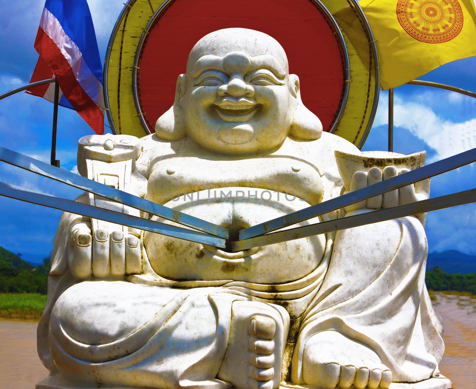 Fat Buddha statue allusions to the coin toss