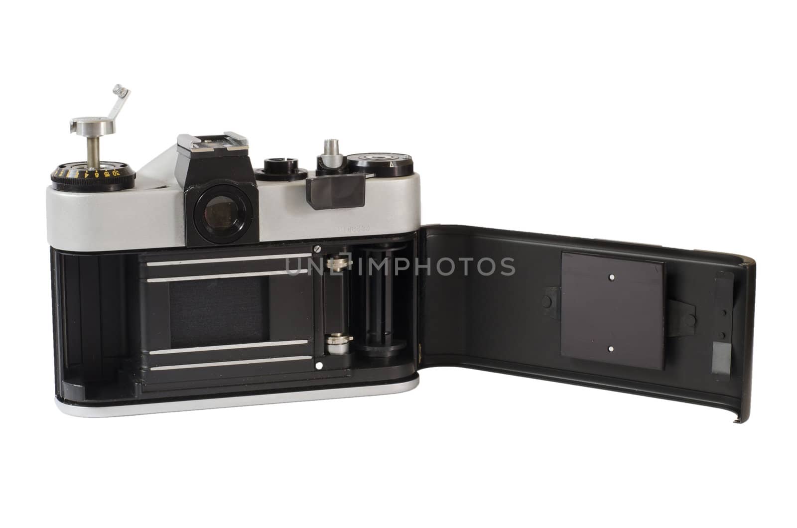 vintage camera with back open on white background