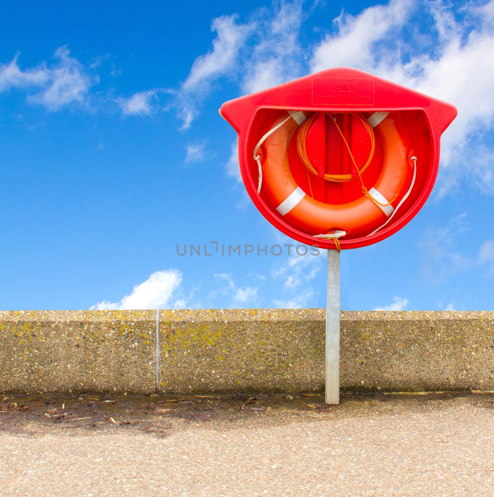 life ring against a bright blue sky by smikeymikey1