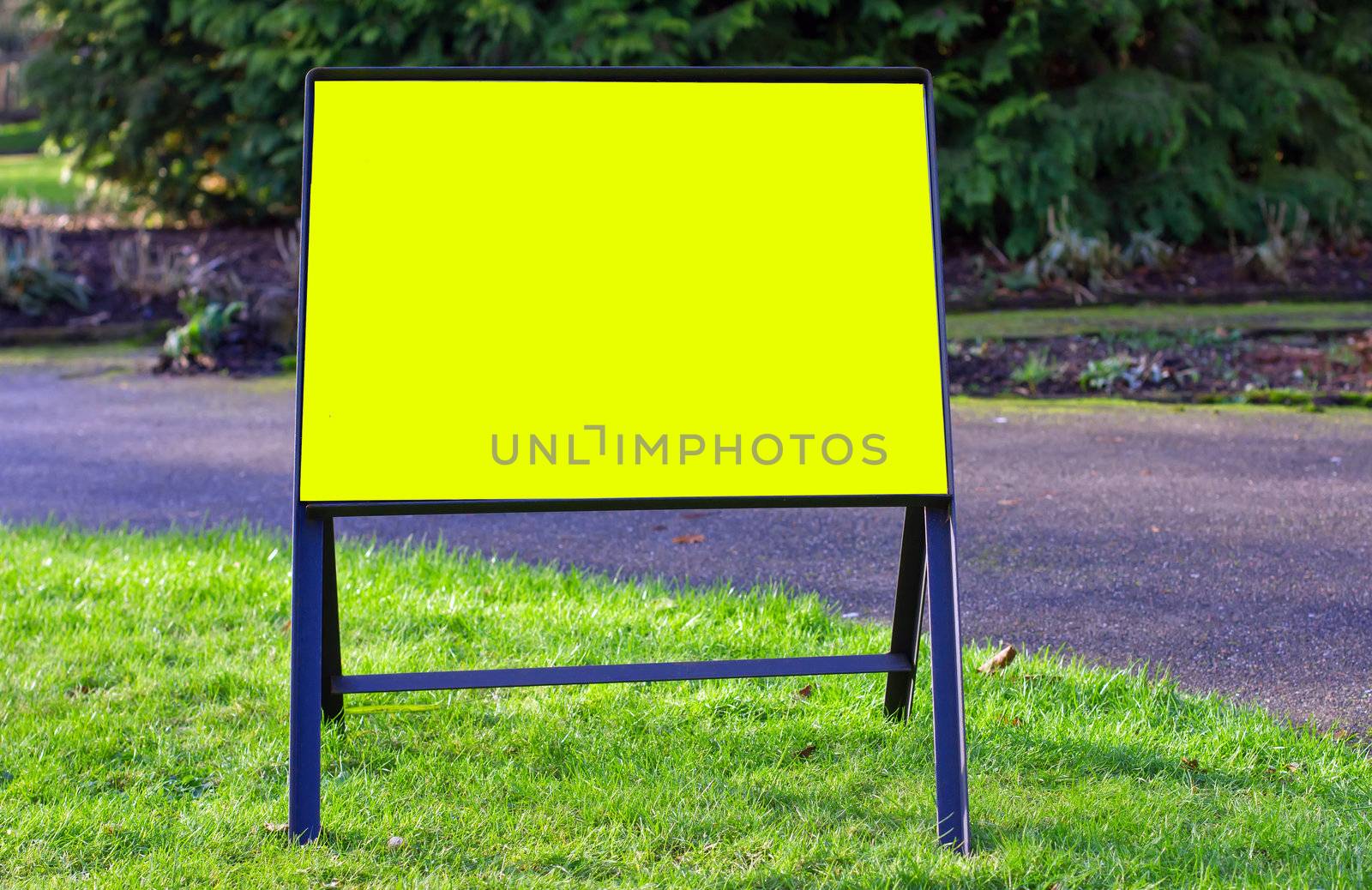blank yellow low sign in the park by smikeymikey1