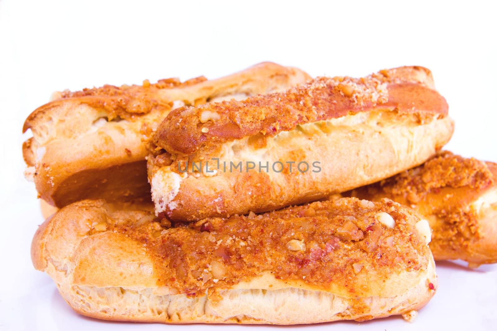 eclair covered with nuts on white background 