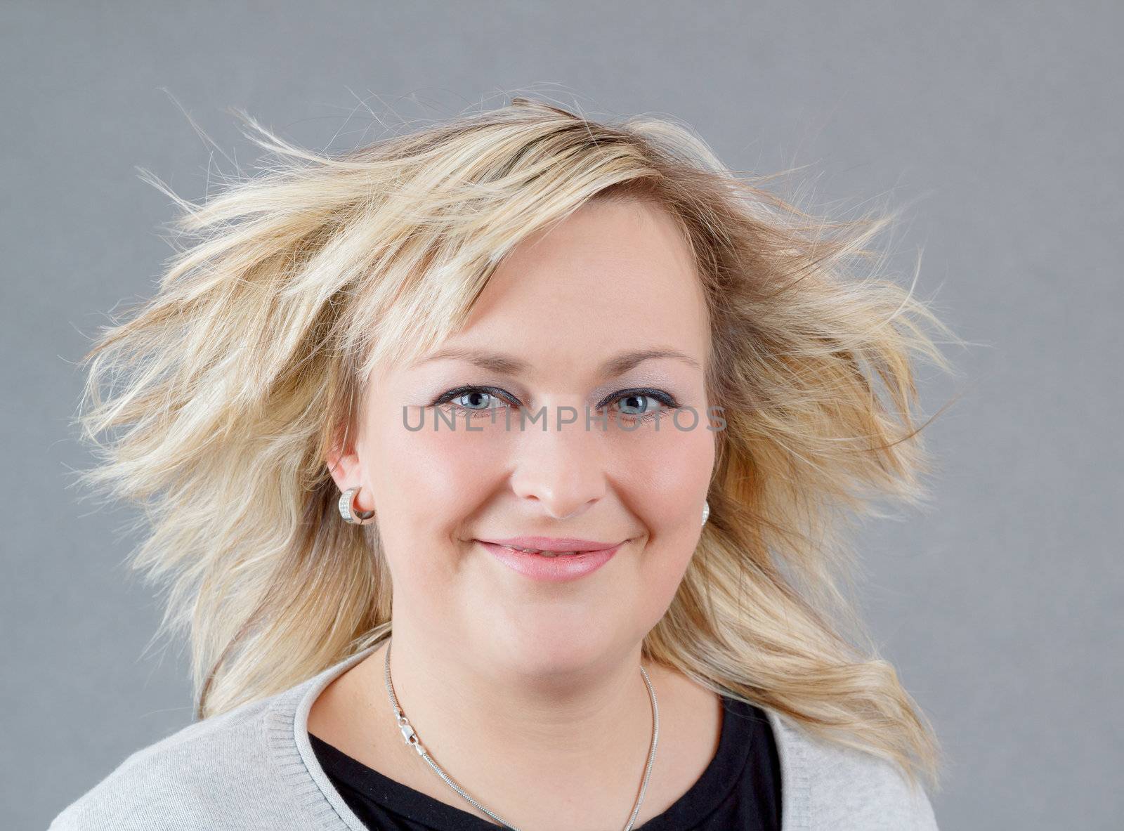 Portrait of cute smiling relaxing plump woman