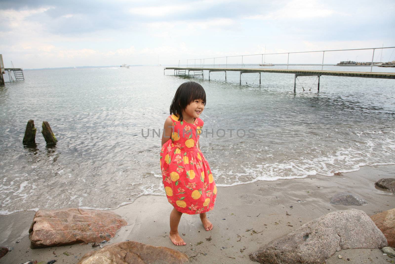 young child  having fun at the beach