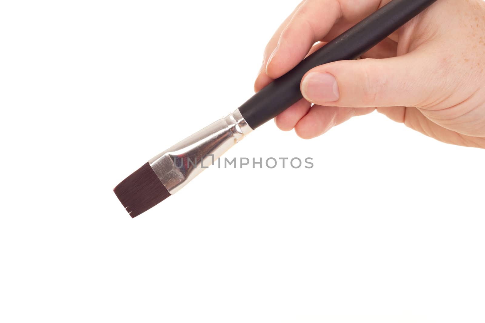Hand with brush isolated on white background