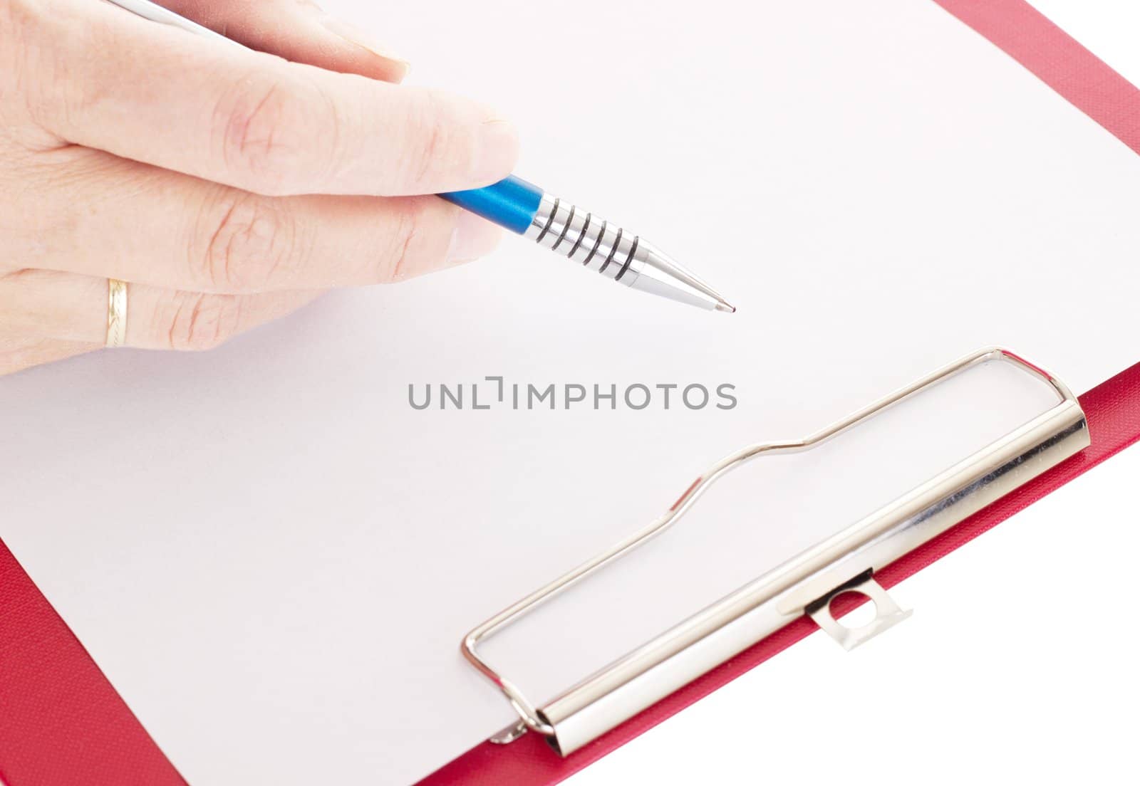 Hand with pen on clipboard