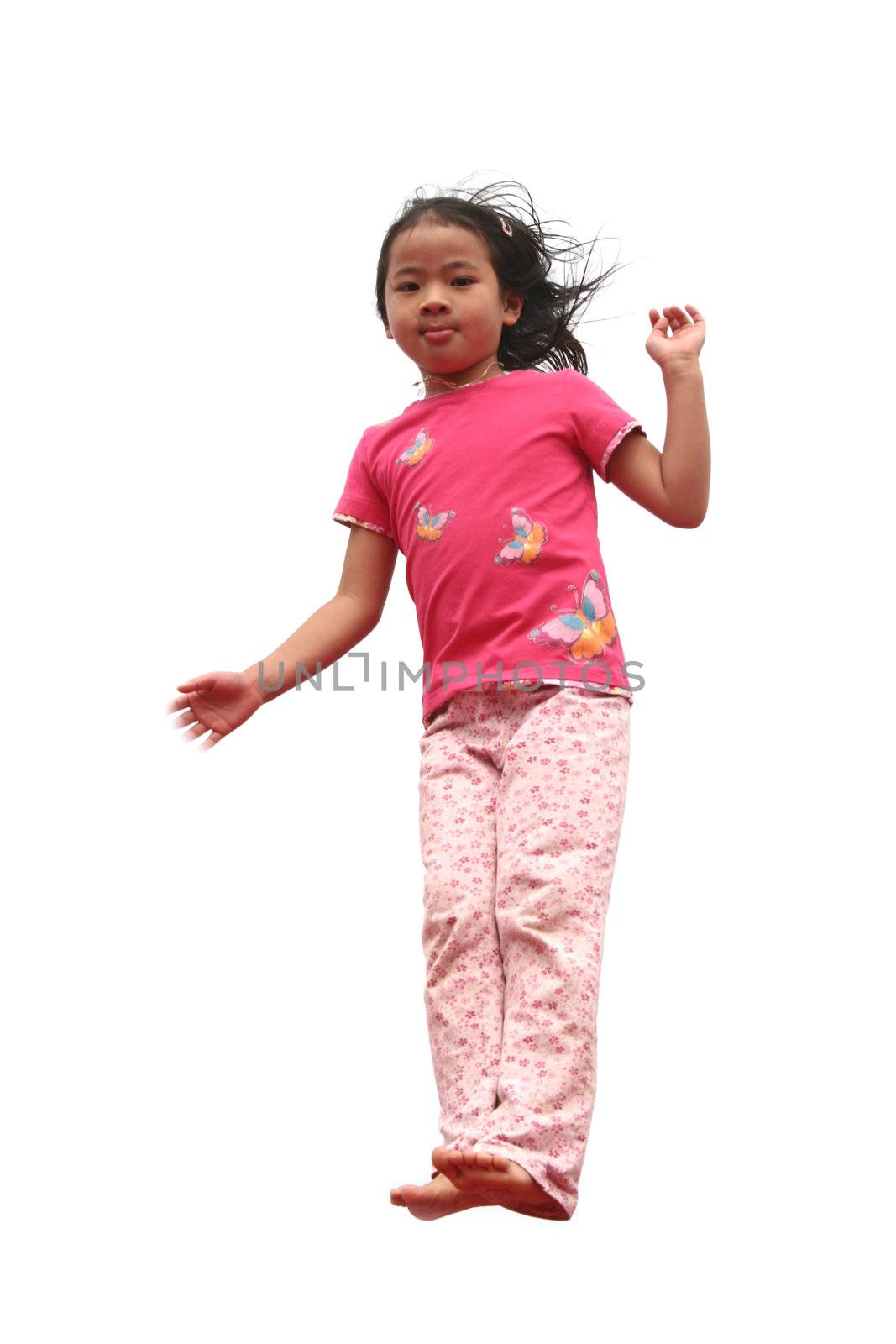 happy child outdoor jumping a summer day
against a white sky