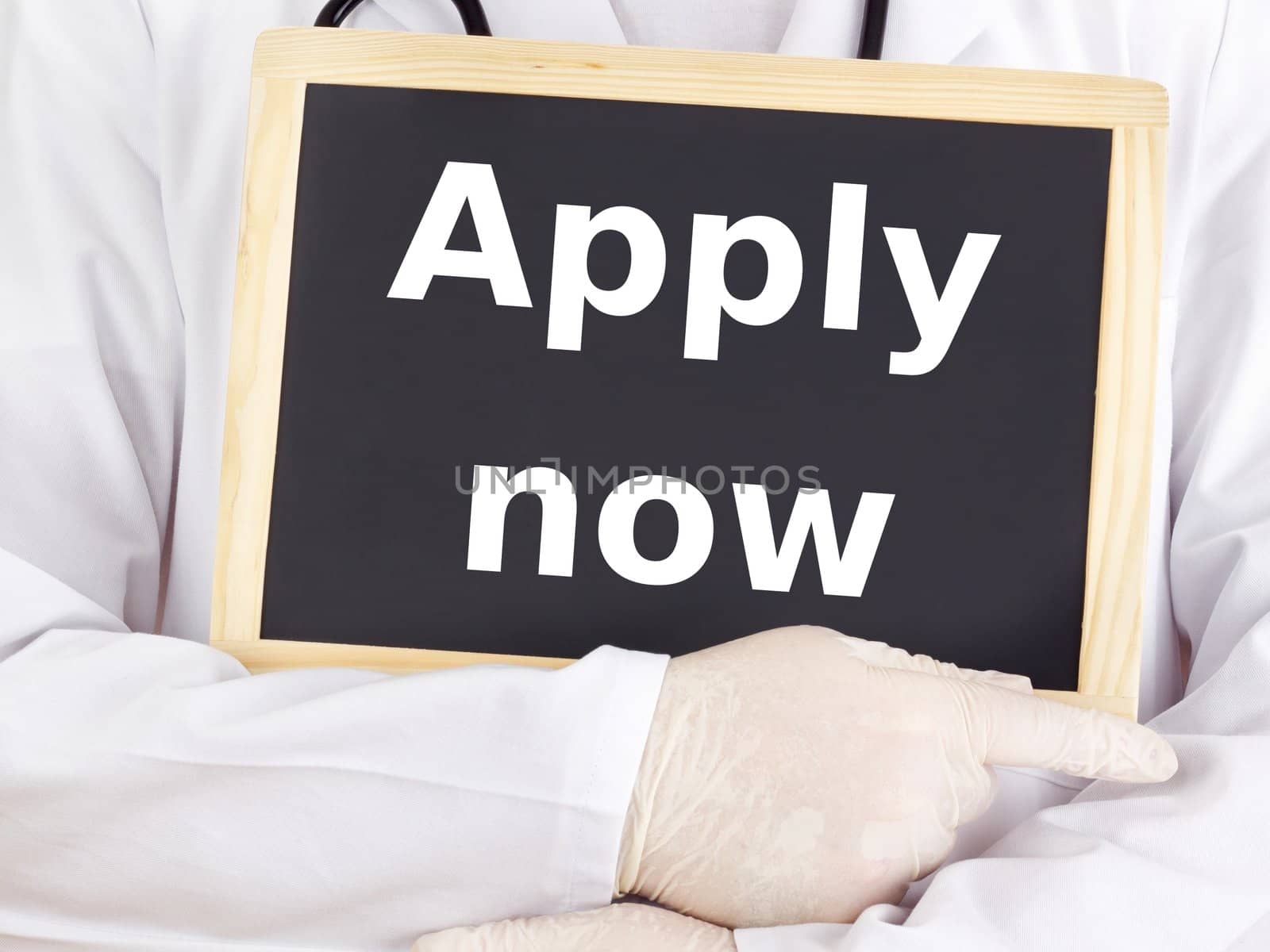 Doctor shows information on blackboard: apply now