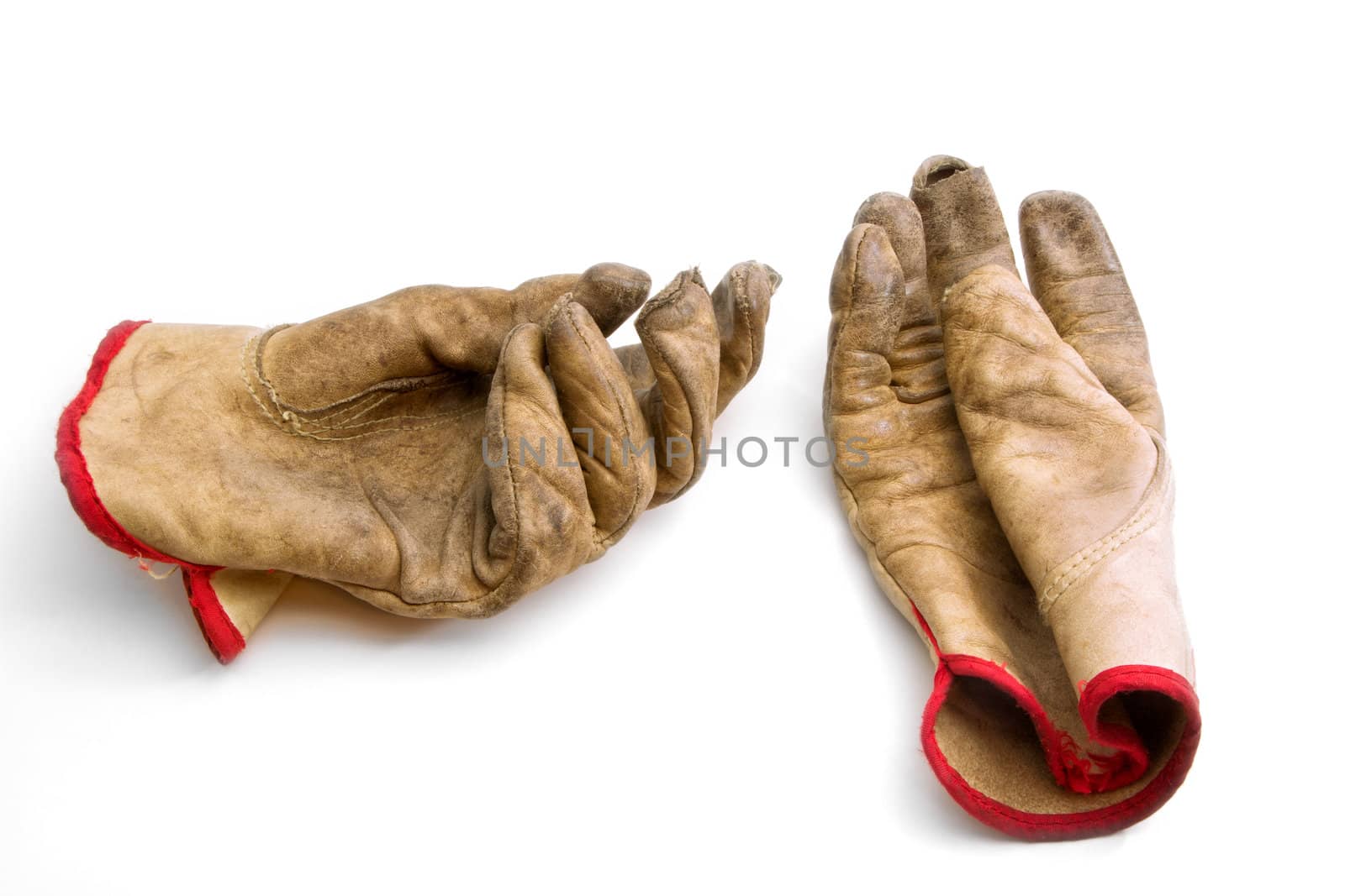 Worn and Weathered Gloves on White Backdrop