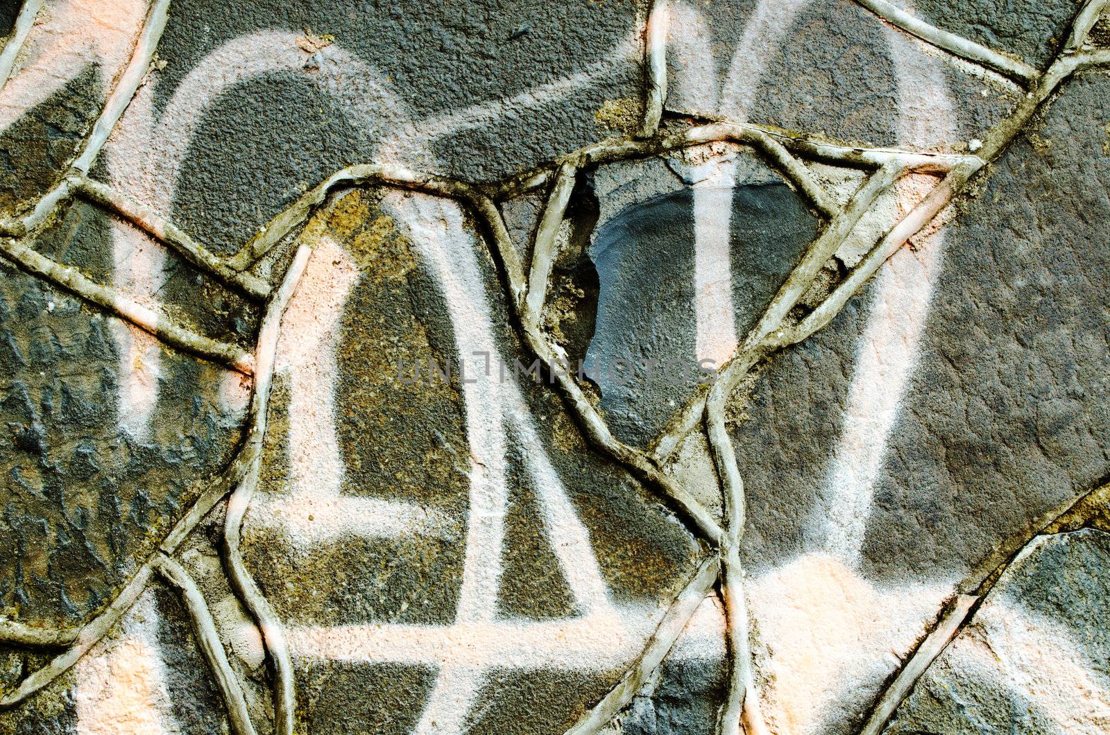 Closeup of graffiti painted masonry concrete retro wall background.