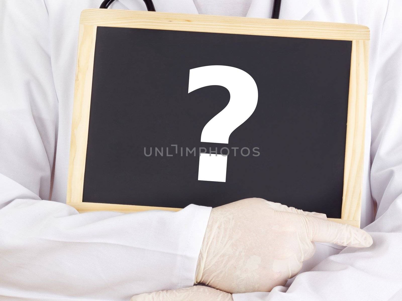 Doctor shows information on blackboard: question mark