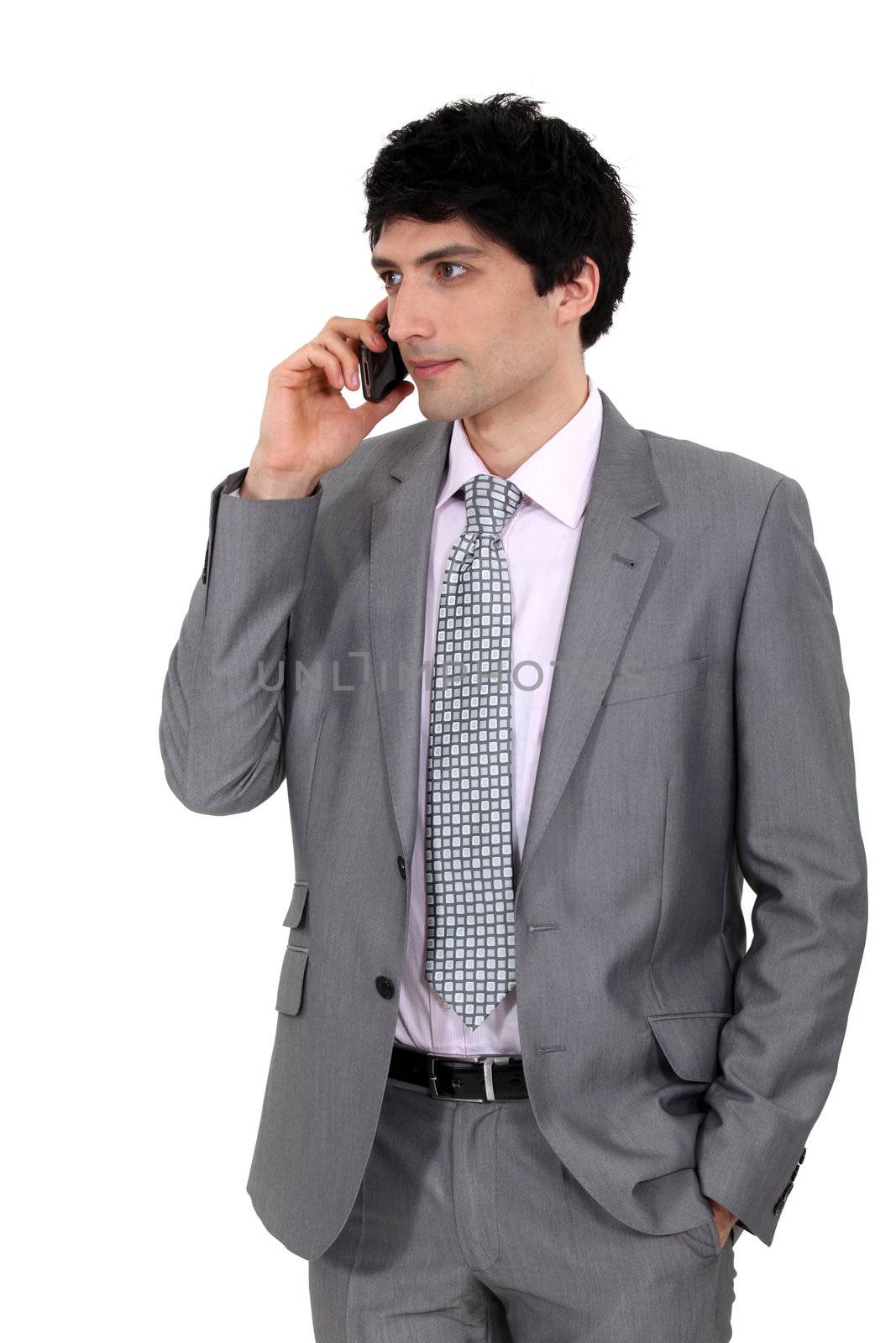Businessman on the phone by phovoir