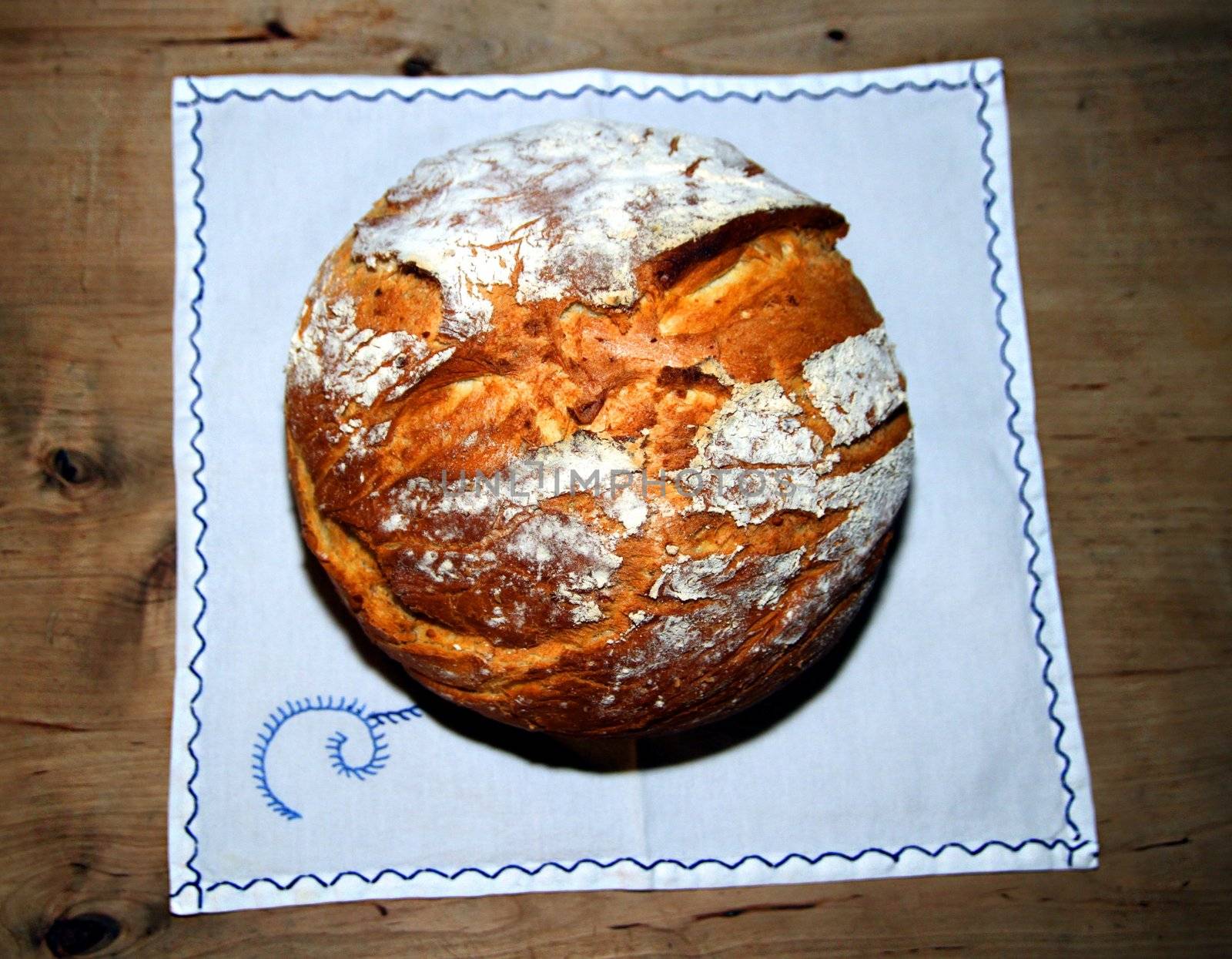 Freshly baked rustique bread on linen cloth