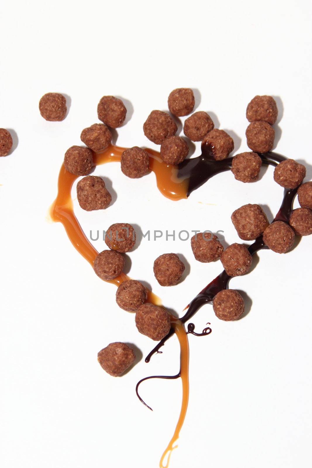 heart of caramel and chocolate on a white background as a symbol of love