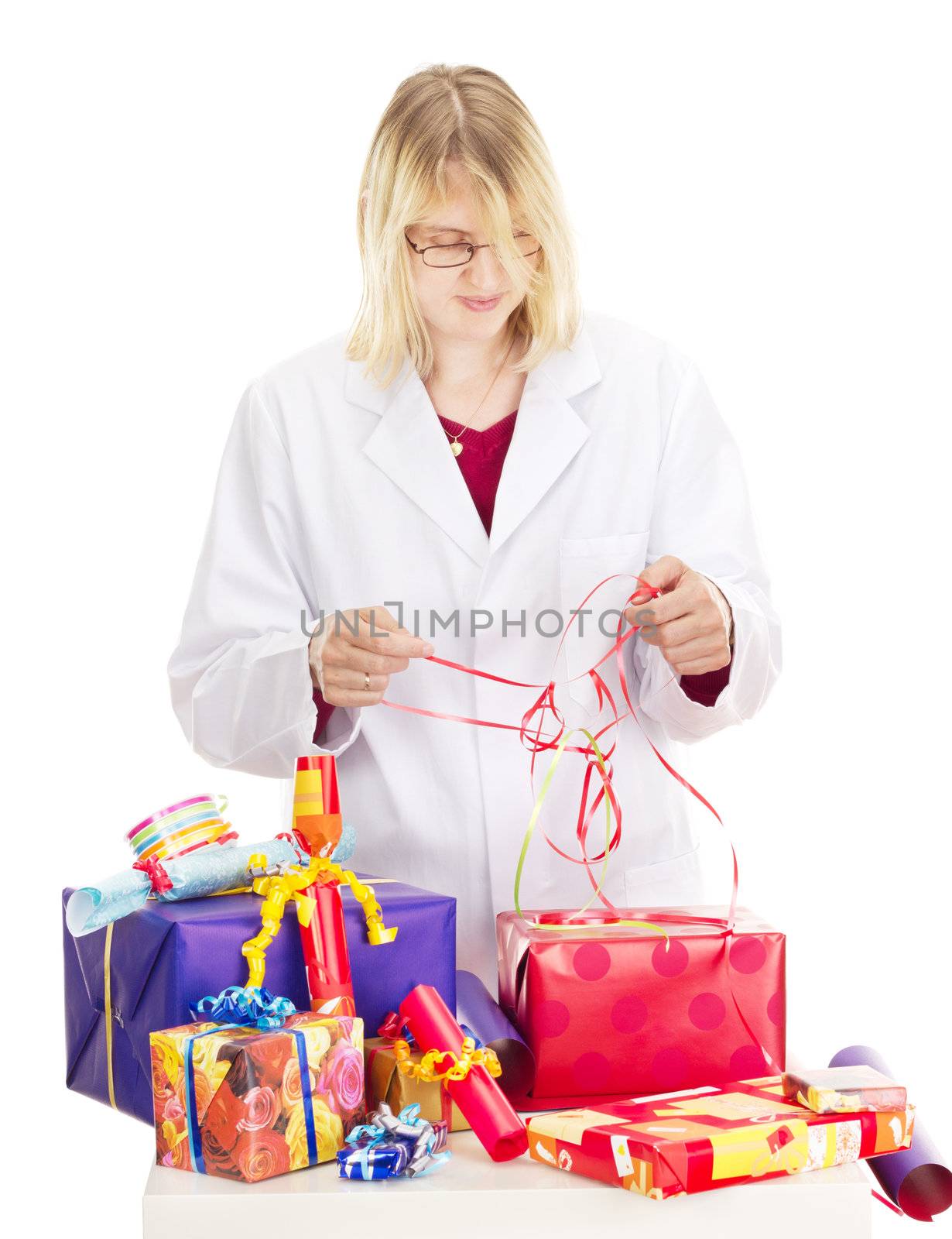 Person packaging some colorful gifts