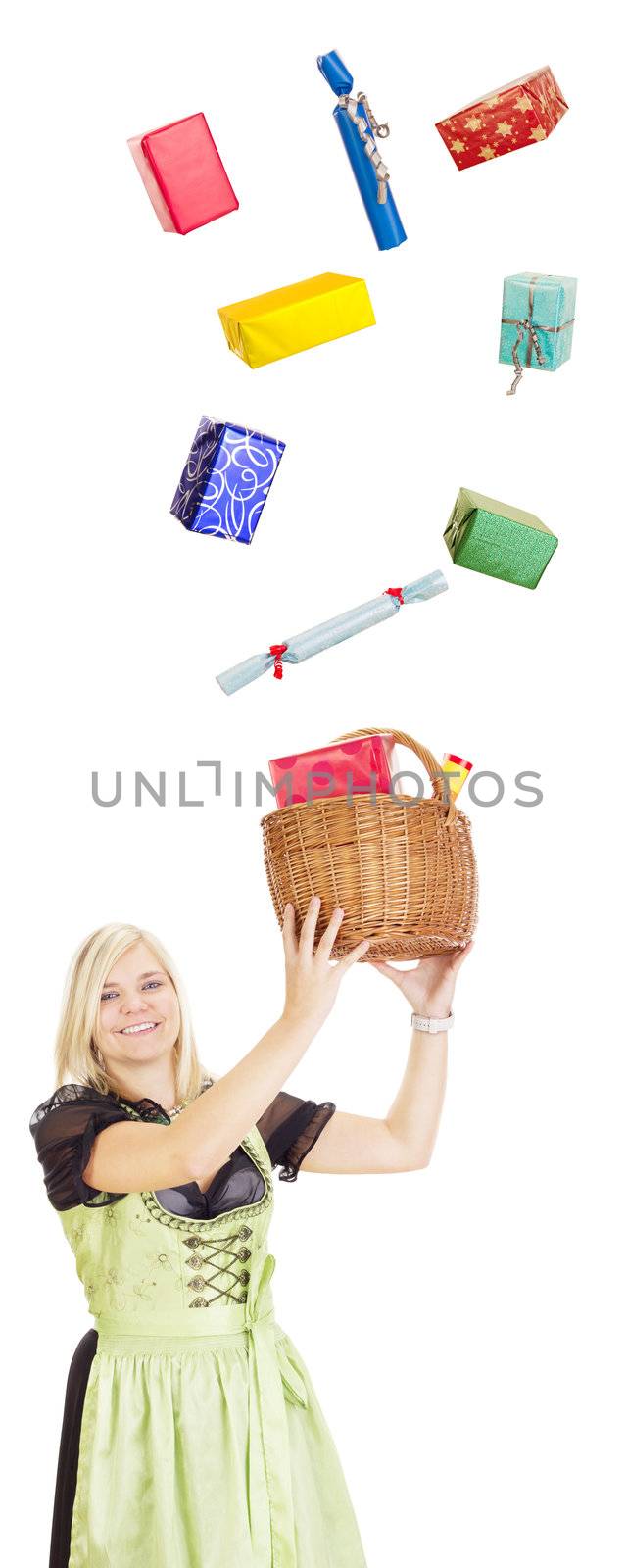 Young woman in traditional costume catching gifts