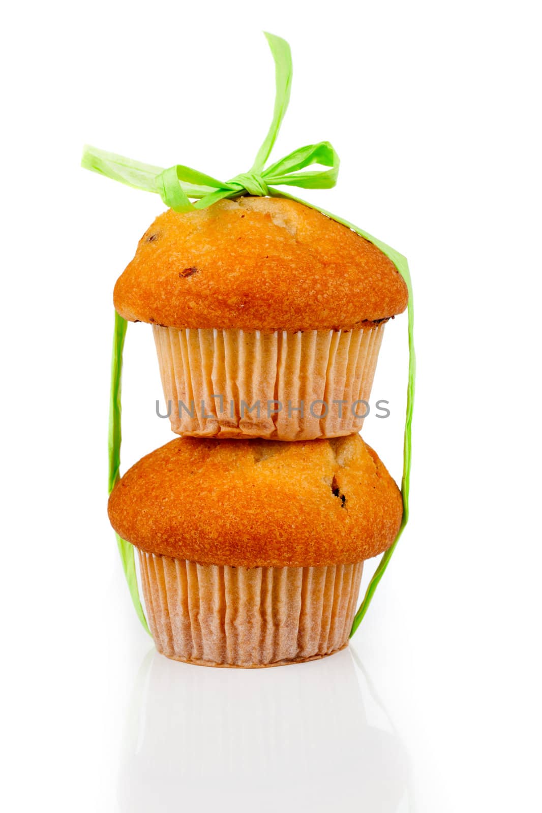 muffins connected by a green tape, on a white background by motorolka