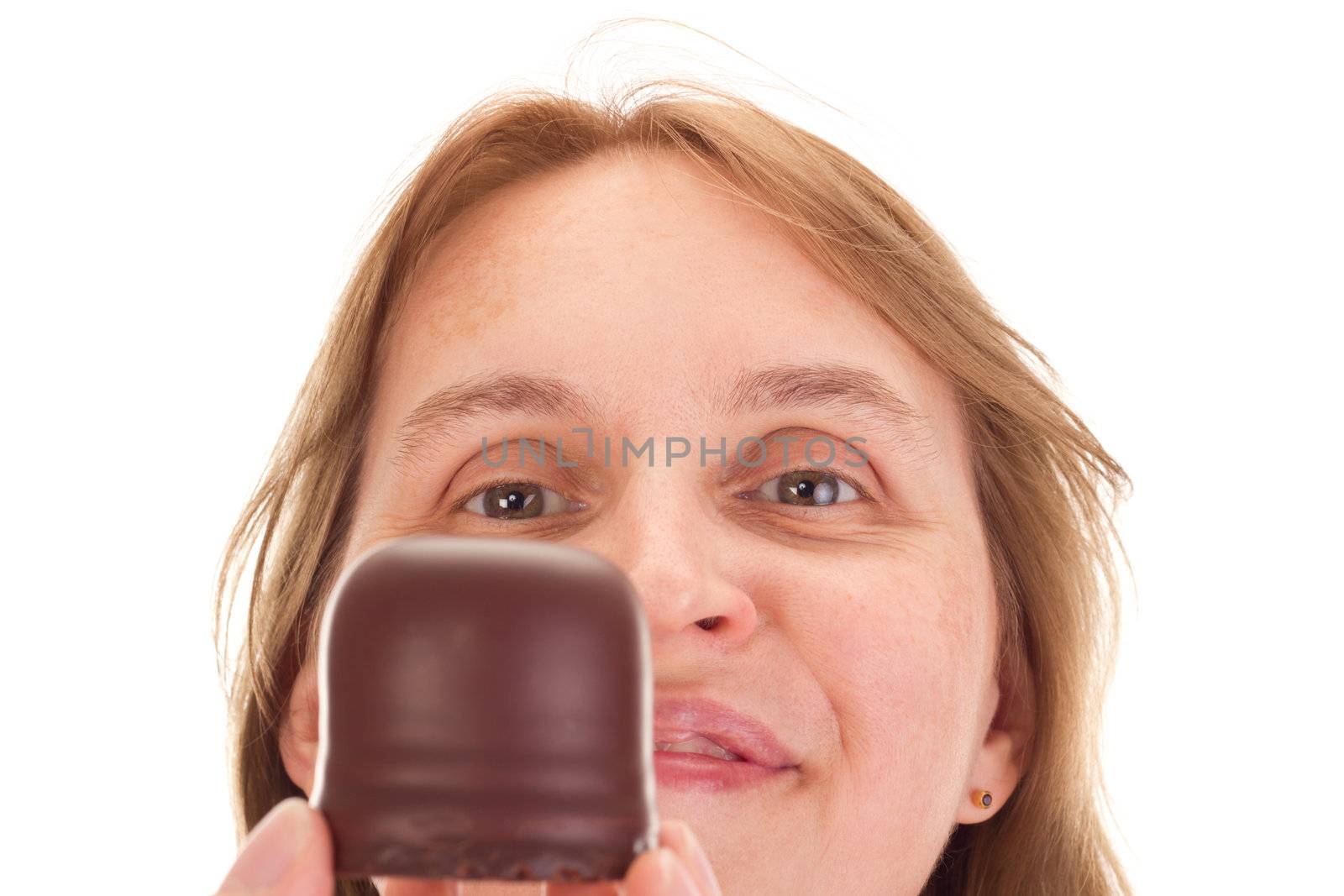 Woman with chocolate marshmallow in the face