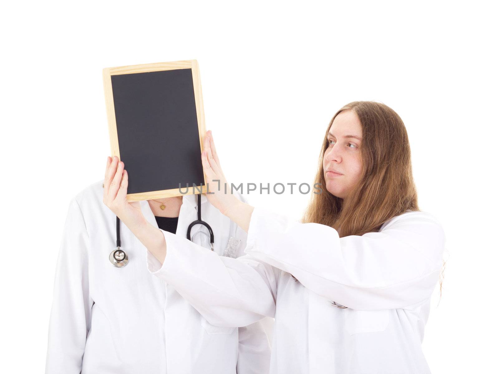 Two female medical doctors with blackboard