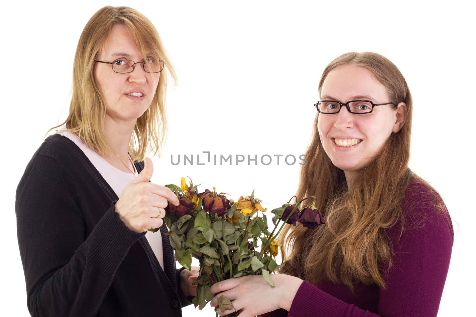 Daughter giving mother dried roses