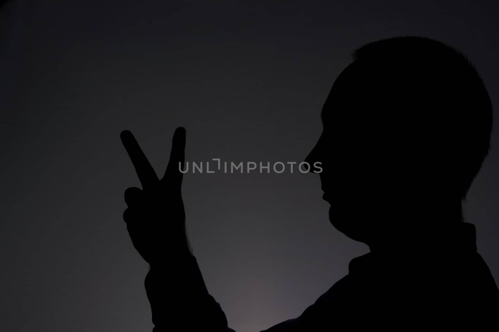 Man showing V sign