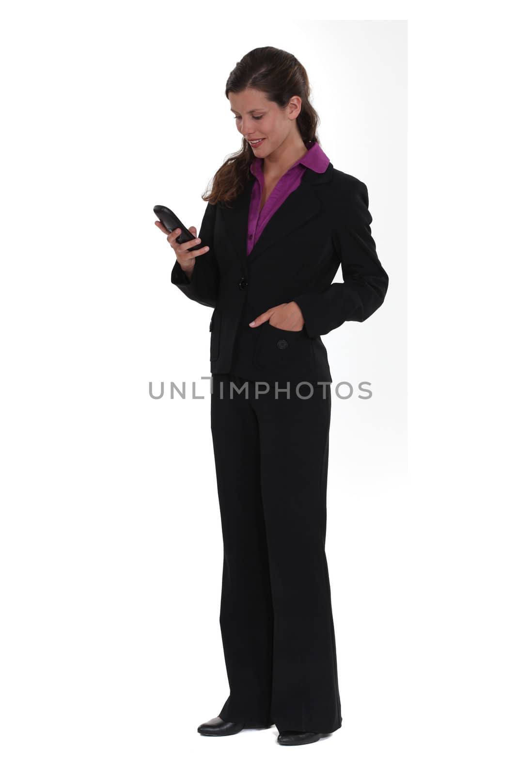 Businesswoman checking e-mails telephone by phovoir