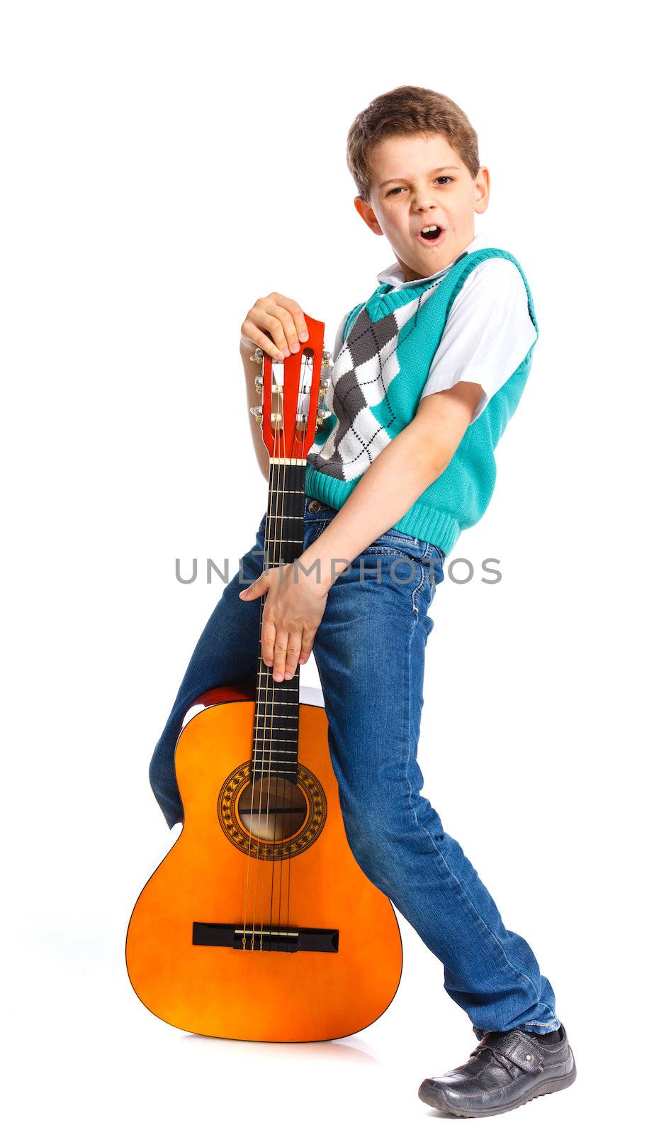 Cute boy with classical guitar. Isolated on white background
