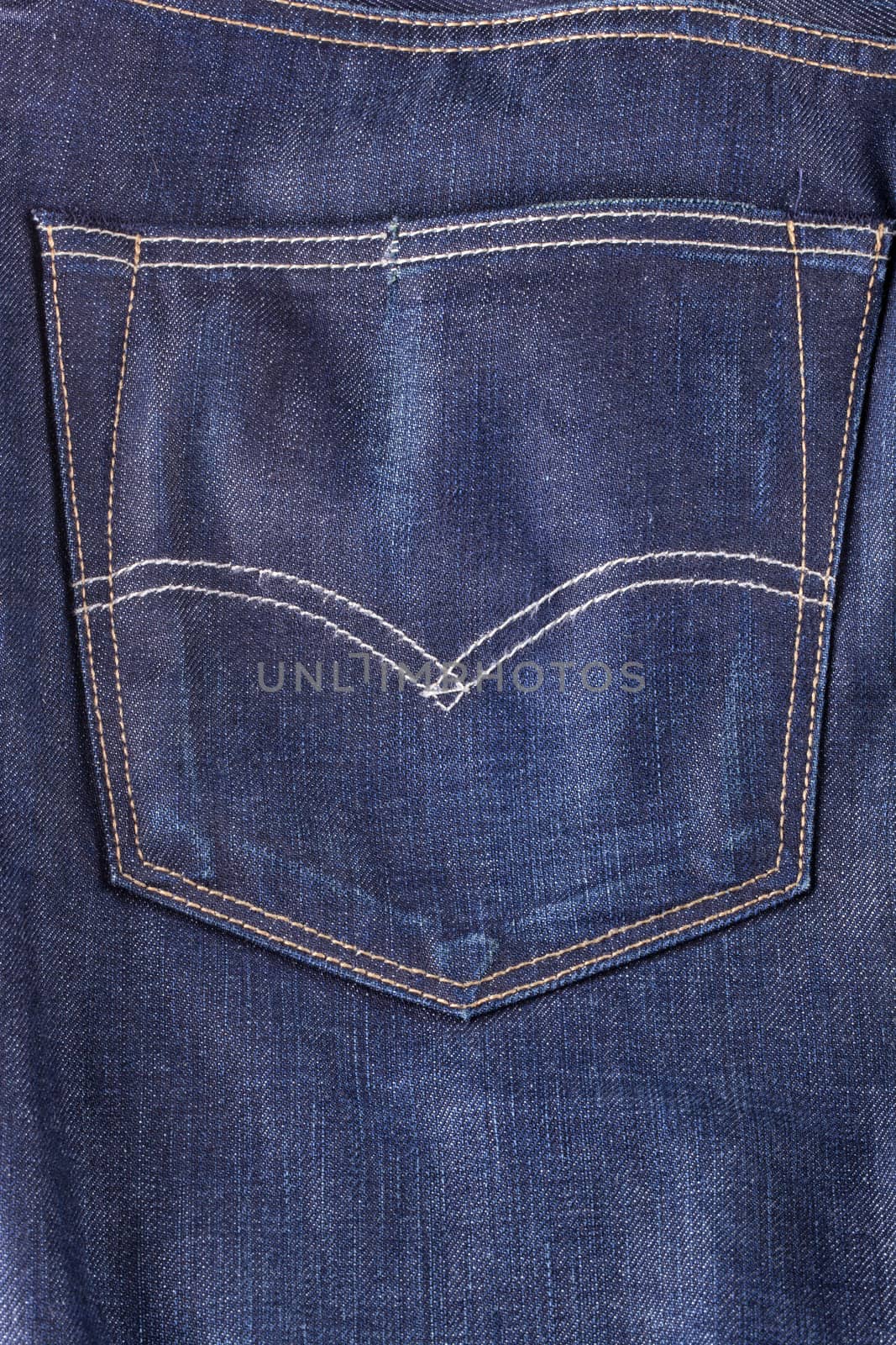 View of a back pocket of jeans trousers