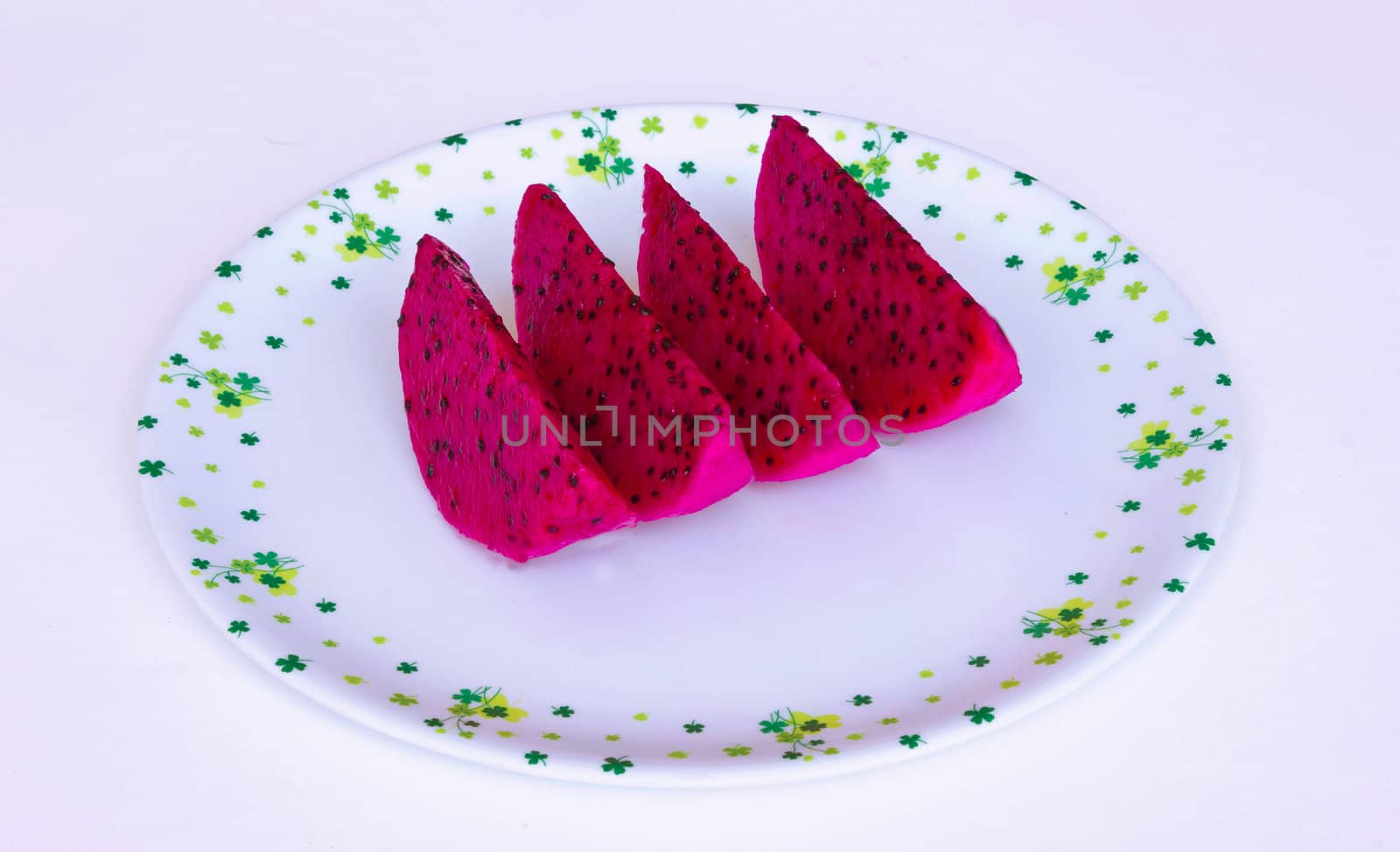 Close up of sliced red dragonfruits isolated over white background by sutipp11