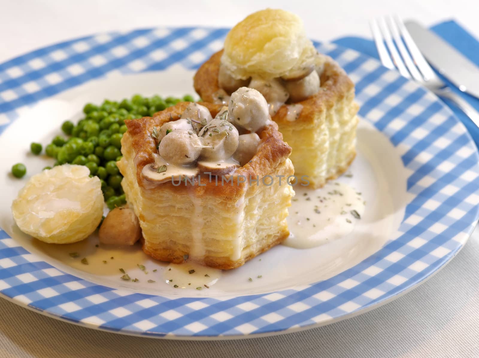 Photo of Pastetli, a traditional Swiss vol-au-vent meal made with a white wine sauce and a mushroom and meat filling.