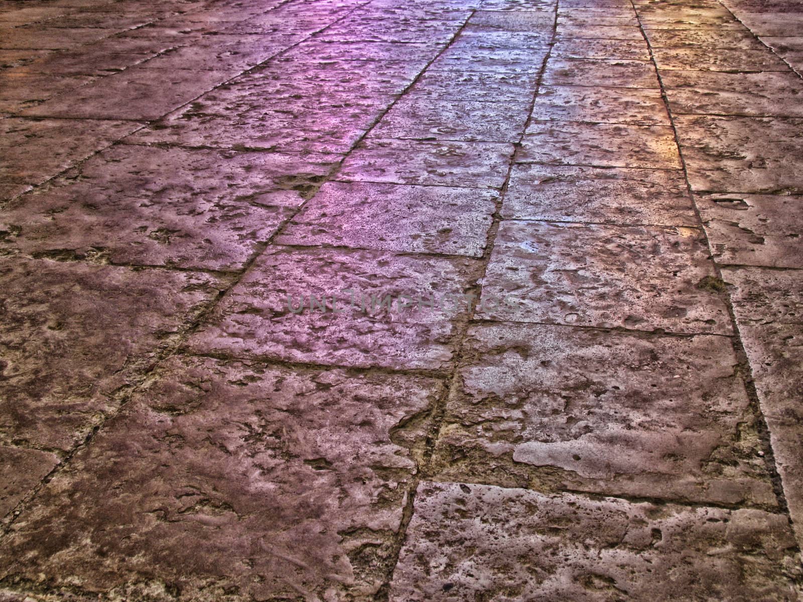 The very old floor of the cathedral of Metz, France. The colors are reflections from the mosaic windows.