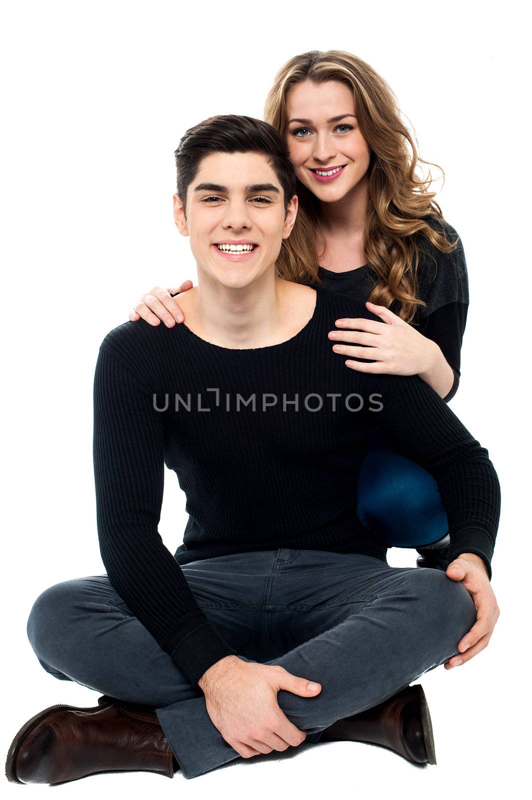 Lovely young girl posing casually with her handsome boyfriend.