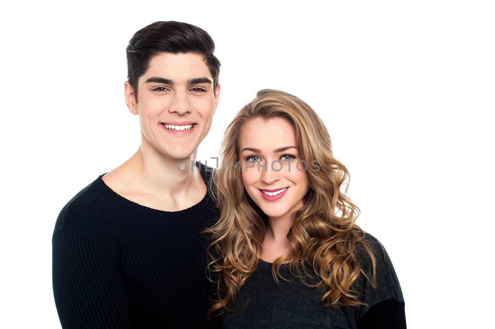 Studio shot of a charming young couple, white background.