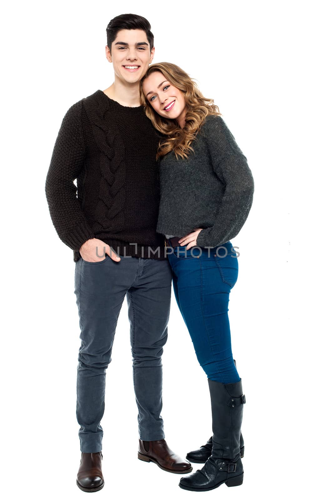 Full length portrait of a young woman leaning on her boyfriend's shoulder.