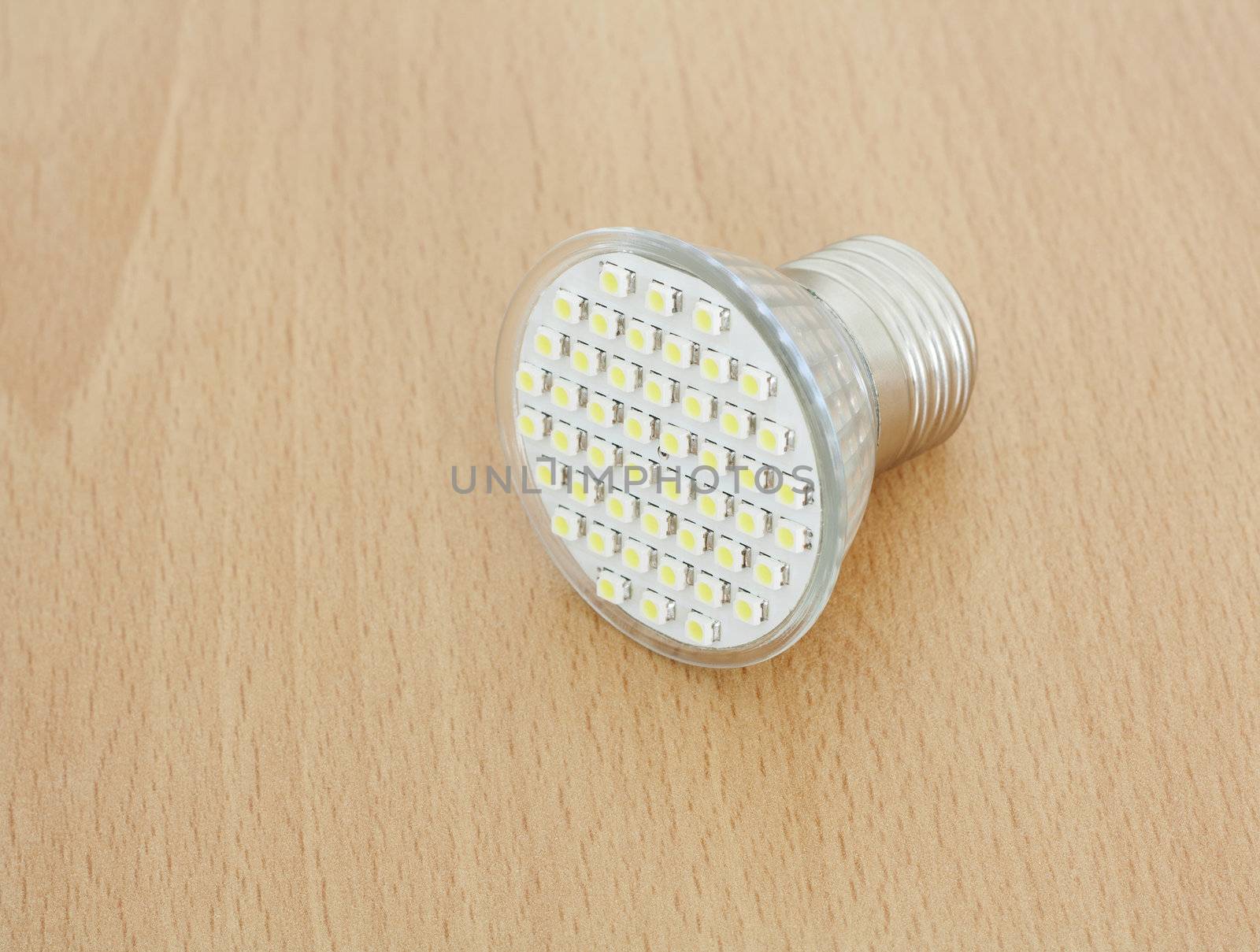 LED bulb on wooden background