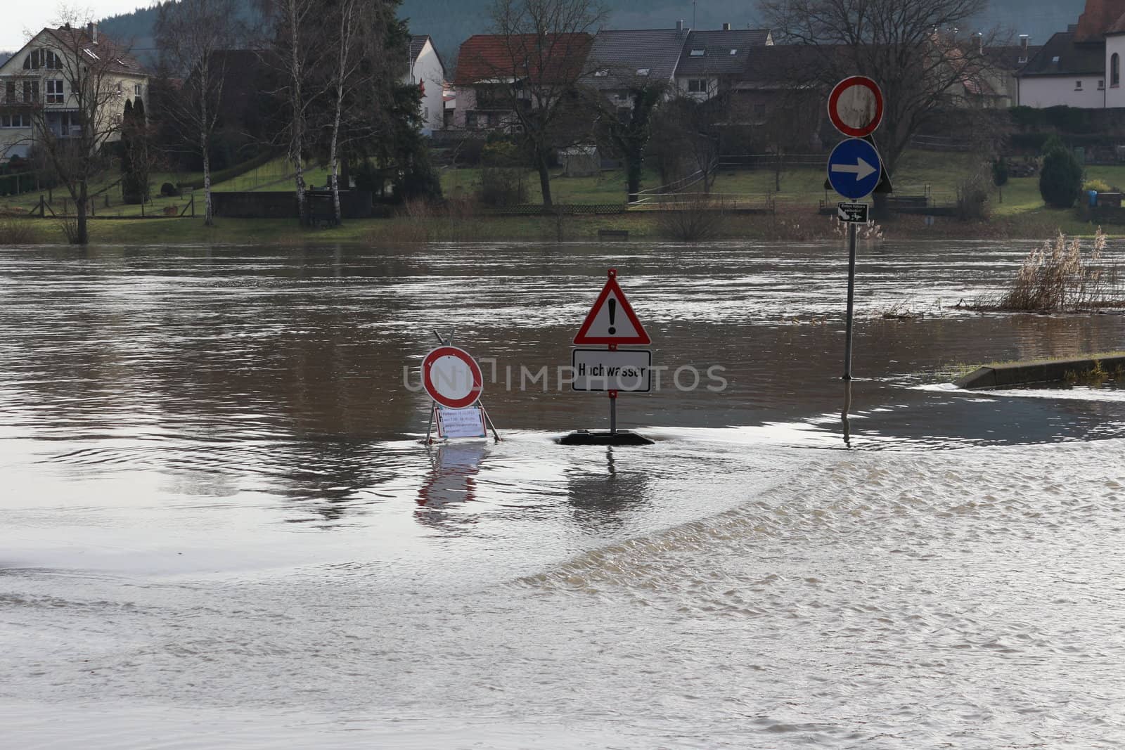 STADTPROZELTEN, BAVARIA/GERMANY - DEC 2012: Flooding of the Main. Stadtprozelten suffers regular flooding of Main. Flood warnings are erected to warn the population.